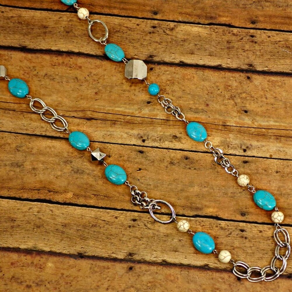 Long turquoise stone bead necklace with white agate stones and silver beads.